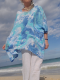 A one size s-4x loose and comfy linen shirt or tunic with small front pockets, hand dyed in pretty sky colors