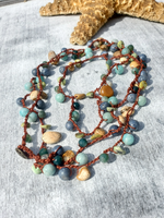 Necklace with multicolored beads on a textured surface