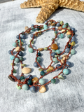 Necklace with multicolored beads on a textured surface