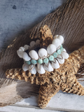 Bracelet with white and turquoise stones on a starfish