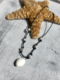 Knotted Leather Cord with Grey Pearls and  a Moon Shell Pendant