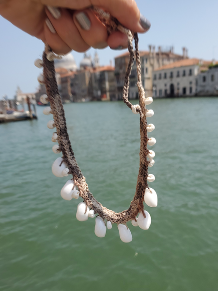 crocheted hemp statement choker with white Moon shells and puka shell beads