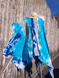 One size tie dye poncho style tunic; cut as a giant rectangle with  feminine wide scoopnek, which can be pulled off of one shoulder. added short sleeves - flexible fit, blue tie dye