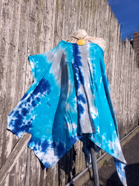 One size tie dye poncho style tunic; cut as a giant rectangle with  feminine wide scoopnek, which can be pulled off of one shoulder. added short sleeves - flexible fit, blue tie dye