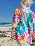 woman wearing a colorful shirt at the beach