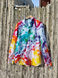 Colorful tie-dye shirt hanging on a wooden fence