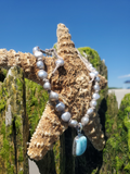 silver pearls necklace at the beach