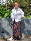 My size XL model Zoey is wearing a maxi skirt with fold over waistband. The tie dye color is black & brown. Zoey has a white denim jacket to complete the outfit