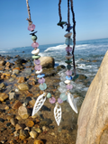 photographed at the beach with the rocks & waves in the back