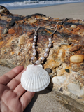 the shell pendant is approximately 2½" across