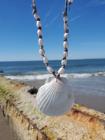 white shell pendant necklace on knotted hemp cord, & pearls