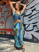 Mariana is modeling a maxi length dress in Tie dye; The slightly A-line style has side pockets, adjustable spaghetti straps. The originally sage colored dress I dyed with navy-olive-denim colors. Marian is a size 4 girl, wearing a wide belt around her waist.