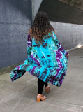 The lightweight ribbed rayon jersey long cardigan is "floating" behind my friend, Mu. The hand dyed colors are gorgeous on this material; purple-green-jade, and a bit of black