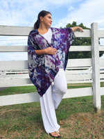 The brusshed surface rayon jersey fabric has a cozy and fuzzy feel. I dyed this piece in purples , the original heather grey color is still showing between the purple areas. Dena has one arm up on the fence, the other hand is holding the open fronts together.