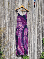 The exact dress I'm offering here is hanging on a hanger, and is photographed on our fence. Long maxi length, side pockets, adjustable spaghetti straps