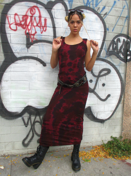 The size 4 mariana is wearing this sexy body hugging maxi tank dress; It is a burgundy colored garment with my black & brown tie dye added.  She's wearing high combat boots and a cool belt with it.