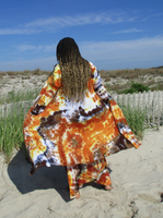 Beach photoshoot (Jones Beach, NY). My friend My is modeling this  very pretty tie dye cardigan: it is a basic midi cardigan with open front, pockets, and a very leigh weight rayon jersey fabric. Here I took a photo of Mu's back. She has her hands in the pockets, also holding out the fronts. The wind is also blowing. Hand dyed colors: brown-khaki-rust-oj.. Mu also has a matching tie dye maxi skirt on, and a sexy white wrap top.