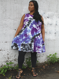 Sleeveless swing mini dress or tunic in tie dye: Purples and black, modeled by an XL beauty