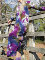 The hand dyed color combo is navy-plum-olive. I'm leaning up against a wooden fence, one leg is up on the rail., showing a bit of my leg et the slit. I have purple socks and DR Martin combat boots on
