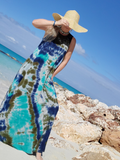 I took this tilted photo; I'm standing at the beautiful  rocks, with the turquoise water behind, I'm holding my hat, so it would cover my face.