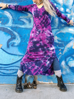 I'm the model for this cool tie dye dresss, standing against a blue graffiti wall, arms up, wide step,leggings-boots sticking out on the sides. The dress has a long length, pockets, side slits and a hood. Oh, and a V-neckline. Colors; navy and plum. 