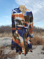 long sleeve wrap cardigan with selft belt; displayed on a form, with belt wrapped around. Asymmetrical front hem, hand dyed in earthy but bright shades; navy-rust-olive